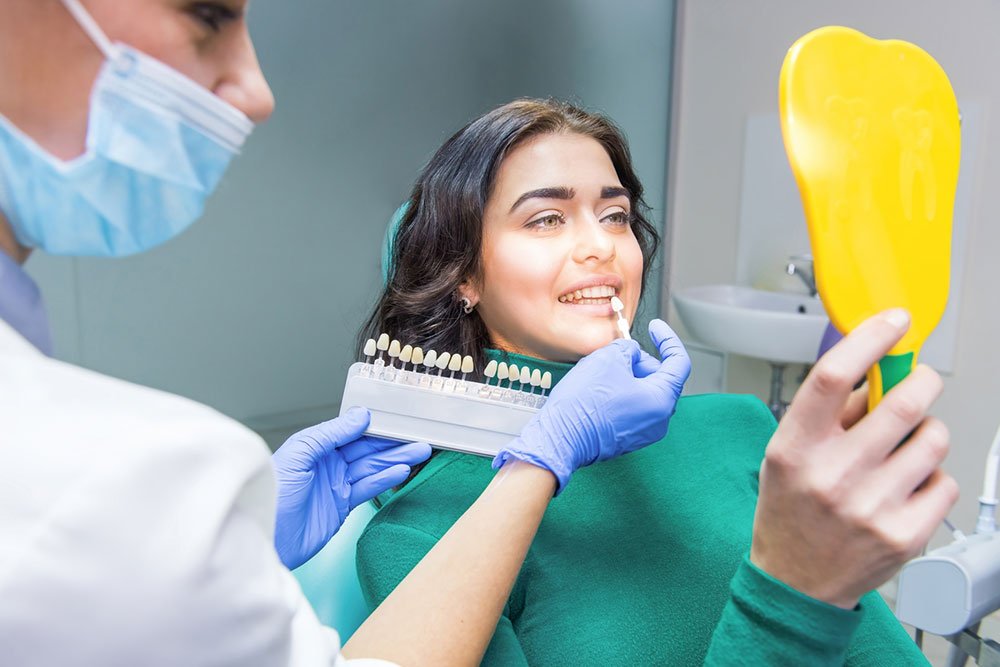 Navigating the Pros and Cons of Dental Implants and Dentures